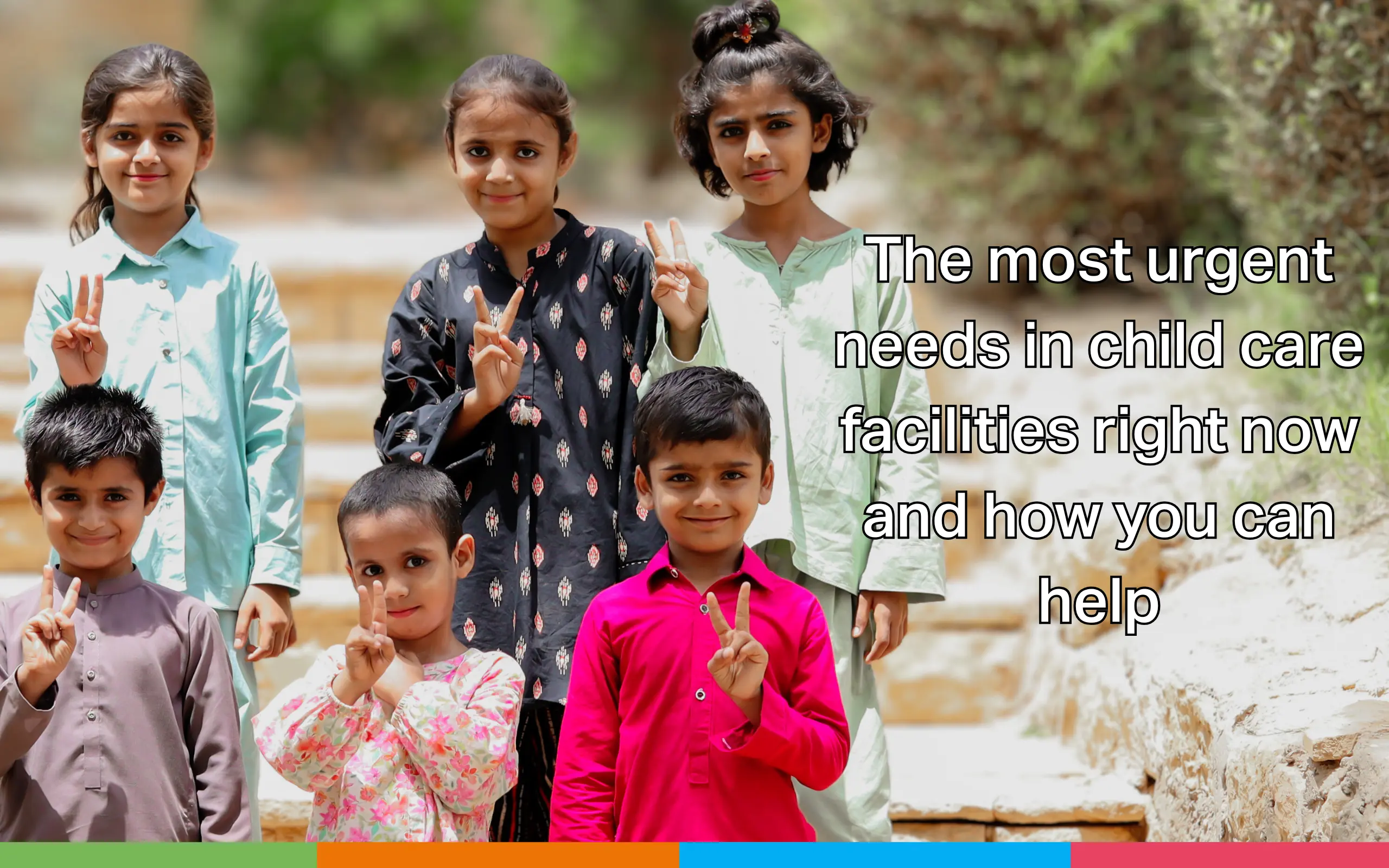 Seven children pose outdoors on stone steps, smiling and holding up peace signs, with text discussing urgent needs in child care facilities and how to help