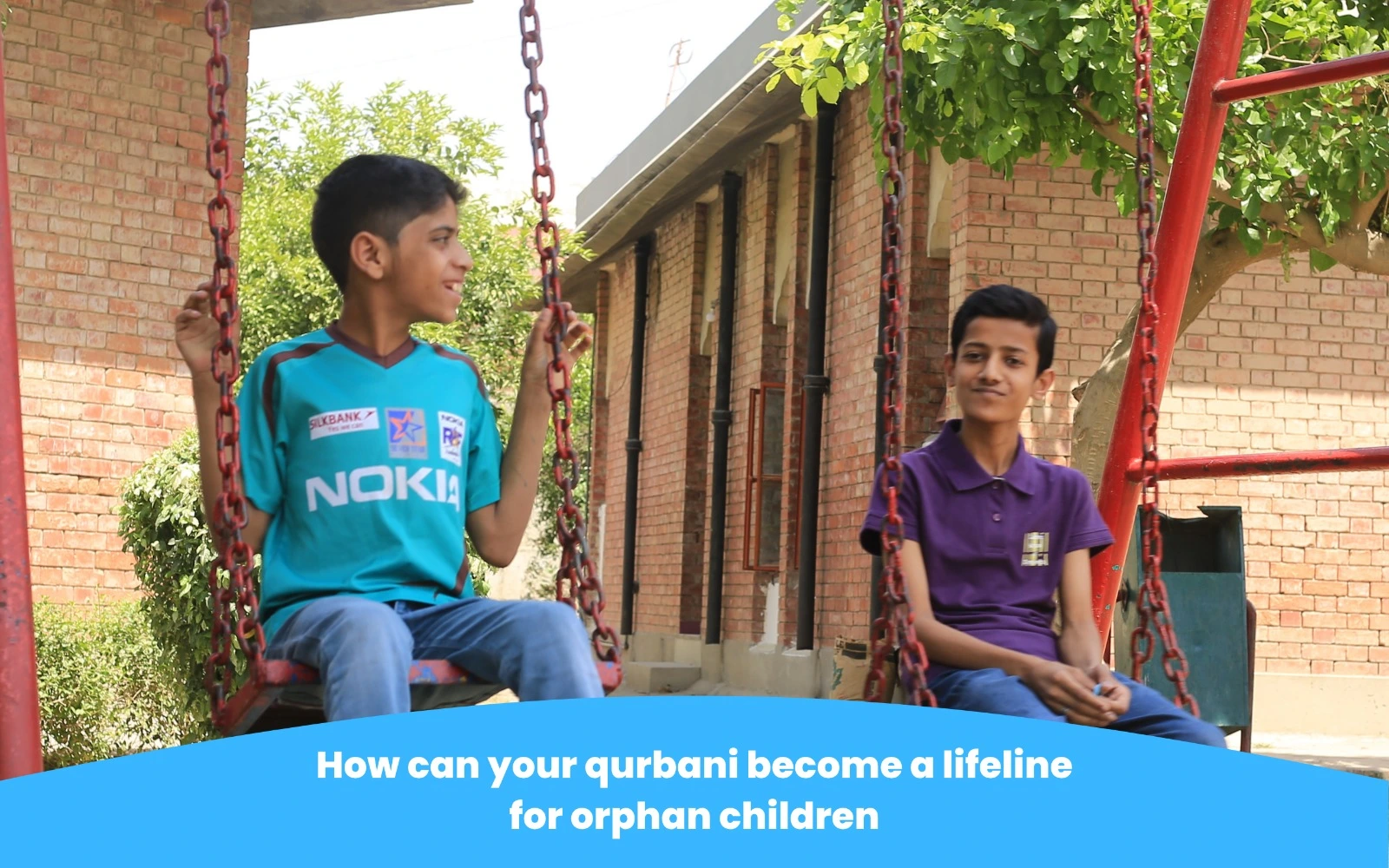 “Children enjoying time on swings highlighting the impact of qurbani support for orphaned children.